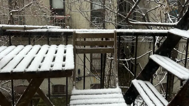 Snow fall on a fire escape in Brooklyn