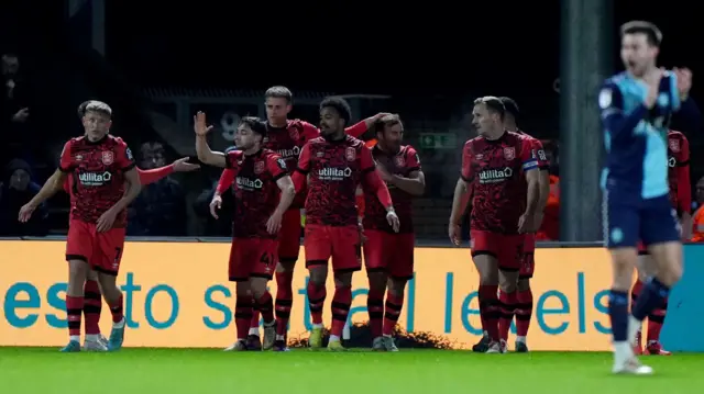 Huddersfield players celebrate Herbie Kane's goal