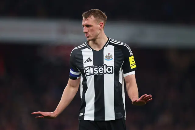 Dan Burn of Newcastle United looks on