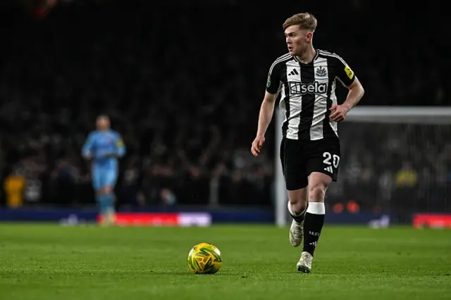 Lewis Hall of Newcastle United on the ball