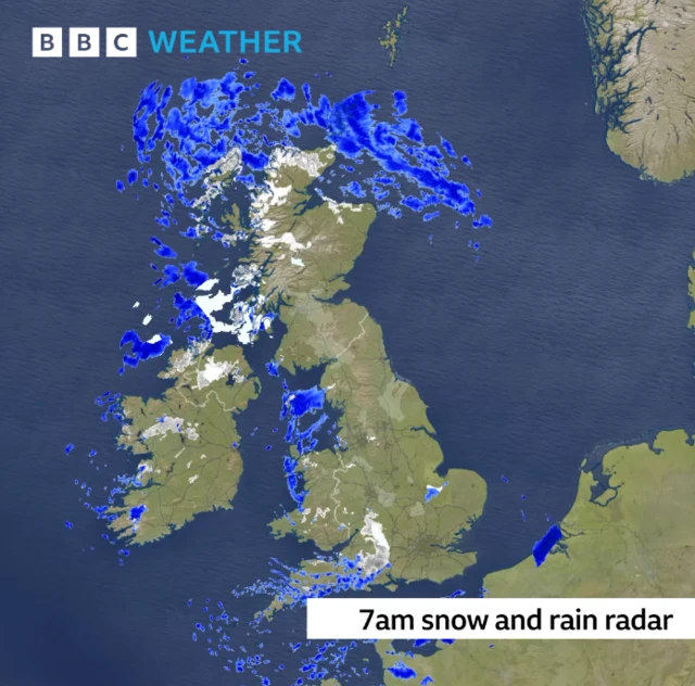 A BBC Weather radar map showing snow and rain over the UK at 07:00 on Tuesday morning