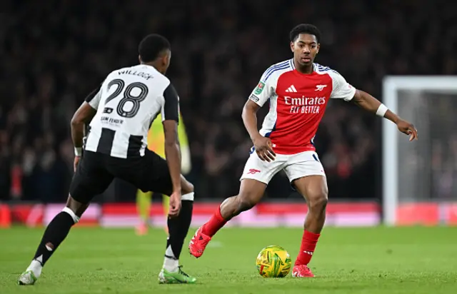 Myles Lewis-Skelly of Arsenal controls the ball