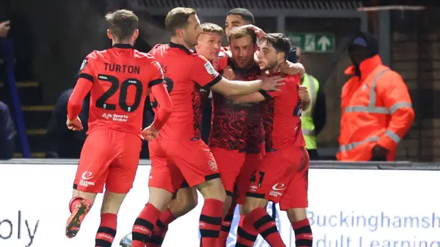 Huddersfield players celebrate Herbie Kane's goal at Wycombe