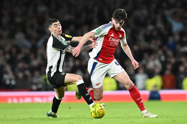 Declan Rice of Arsenal is challenged by Miguel Almiron