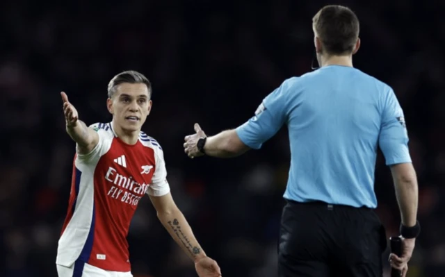 Arsenal's Leandro Trossard with the assistant referee