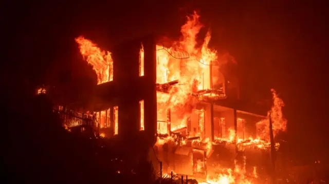 A house engulfed by flames