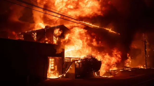 A house engulfed by flames