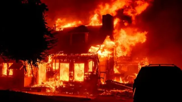 A home burns during the Eaton fire in the Altadena area of Los Angeles County,