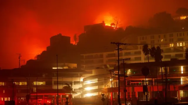 A building burns during the Palisades Fire in the Pacific Palisades neighborhood of west Los Angeles, California, January 7, 2025