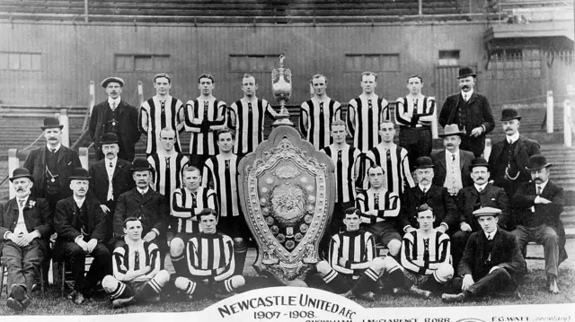 Newcastle with a giant trophy