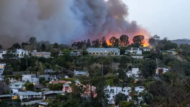 A wildfire rages in the Pacific Palisades area of Los Angeles.