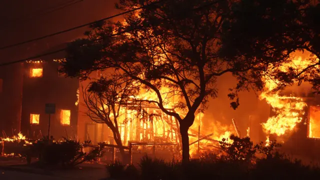 Homes burn from the Palisades wildfires