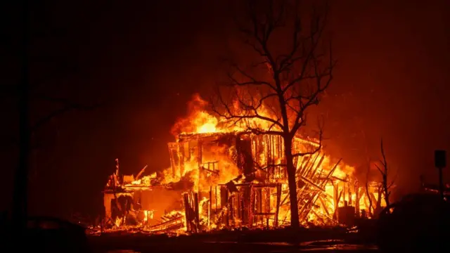 Flames engulf a structure in Pasadena, California.