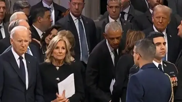 Obama speaking to Harris, standing  next to Jill and Joe Biden on one side, and Trump on the other