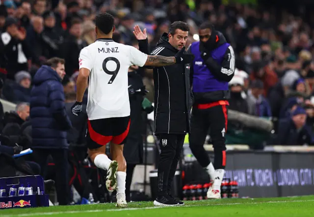 Rodrigo Muniz of Fulham celebrates with Marco Silva