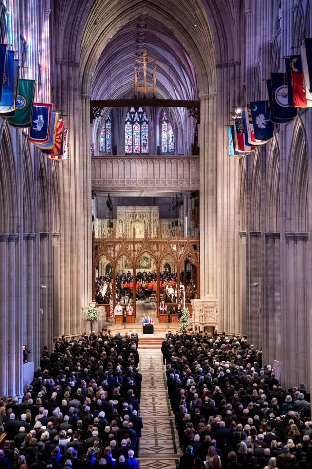 Rows of people gathered in the cathedral