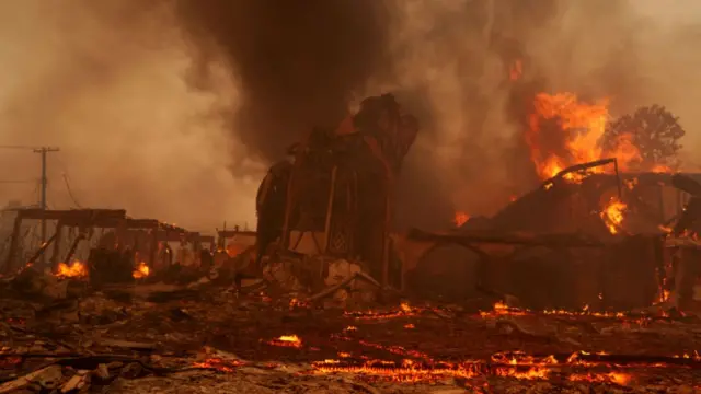 Flames from the Palisades Fire burn a church on January 8, 2025 in the Pacific Palisades neighborhood of Los Angeles, California.