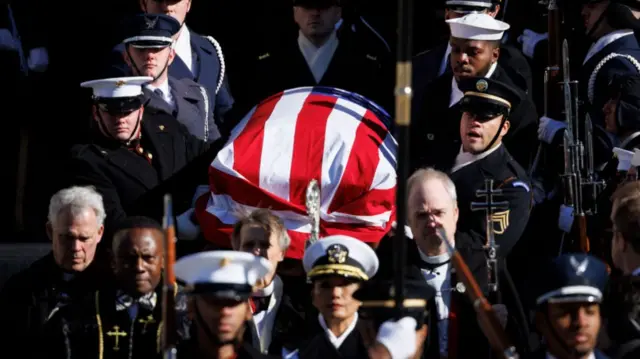 Jimmy Carter casket being carried out of the cathedral