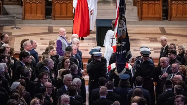 The flag-draped casket of former US President Jimmy Carter arrives at Washington National Cathedral for his state funeral