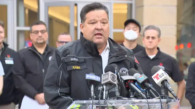 Pasadena Mayor Victor Gordo speaks in front of microphones