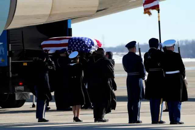 Carter's casket loaded into plane