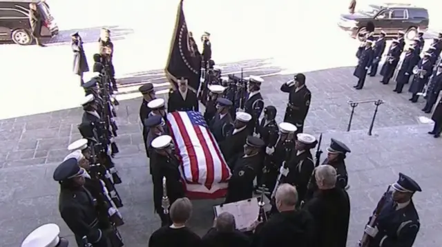 Casket entering cathedral