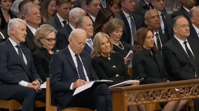 Joe Biden sits in the pews at Jimmy Carter's state funeral