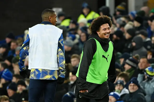 Ashley Young of Everton and Tyler Young warm-up