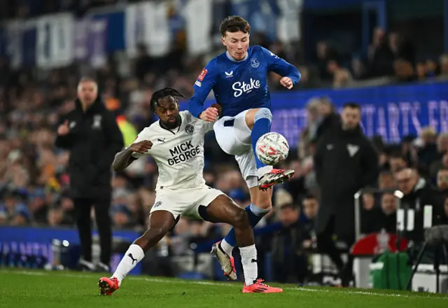 Nathan Patterson of Everton is challenged by Ricky Jade-Jones of Peterborough United