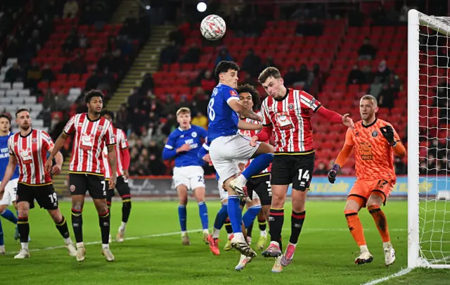 Harrison Burrows of Sheffield United heads the ball