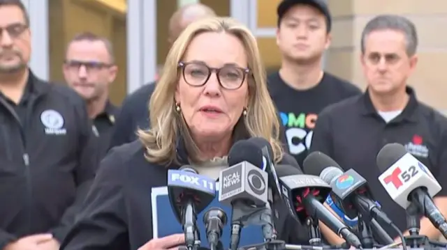 LA County Supervisor Kathryn Barger speaks in front of microphones