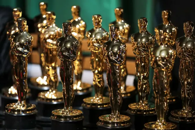 Oscar statuettes are seen backstage