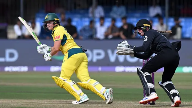 Alyssa Healy of Australia bats as wicket keeper Izzy Gaze of New Zealand looks on during the ICC Women's Cricket World Cup
