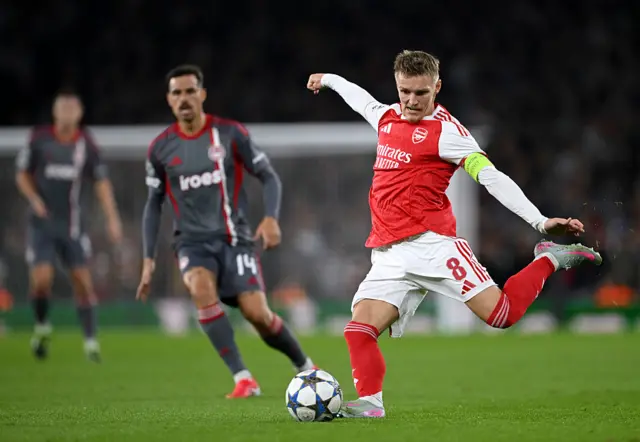 Martin Odegaard passes the ball
