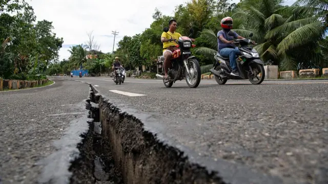 The aftermath of the earthquake is evident in Tabogon town, where a crack has emerged along a major highway