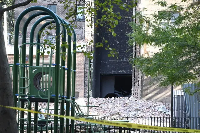 Layers and layers of bricks at the foot of a tower which partially collapsed following an explosion