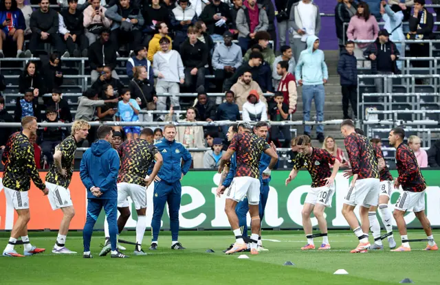 Newcastle players warm-up at Lotto Park