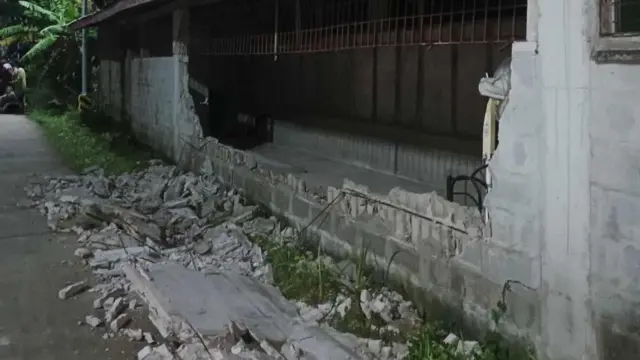 A damaged house in Demape's neighbourhood