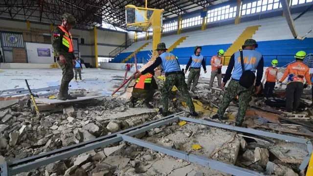 Meanwhile rescuers inspect the damage in San Remigio, a town about 15km from Bogo