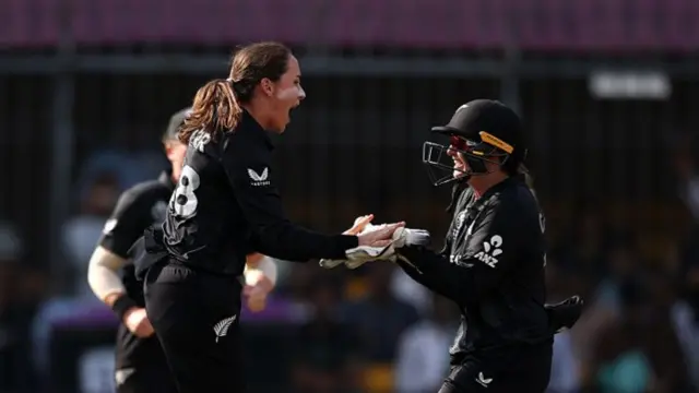 Melie Kerr of New Zealand celebrates with team mate Izzy Gaze after taking the wicket of Phoebe Litchfield of Australia