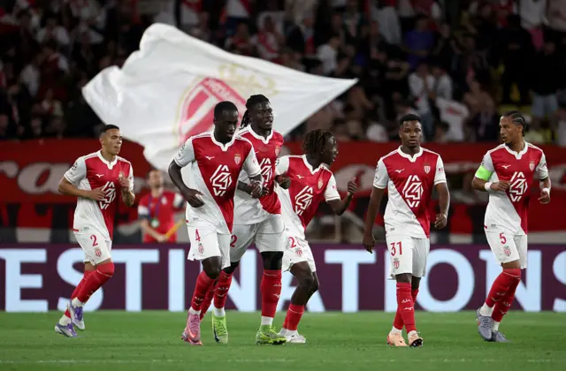 Jordan Teze of Monaco celebrates scoring his team's first goal with teammates