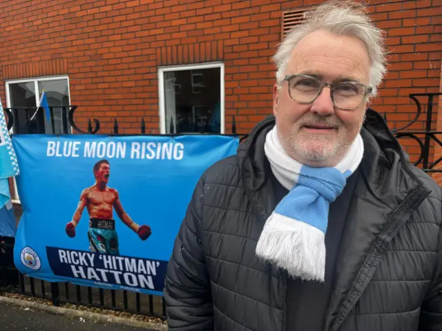 A mourner outside Hatton's Gym