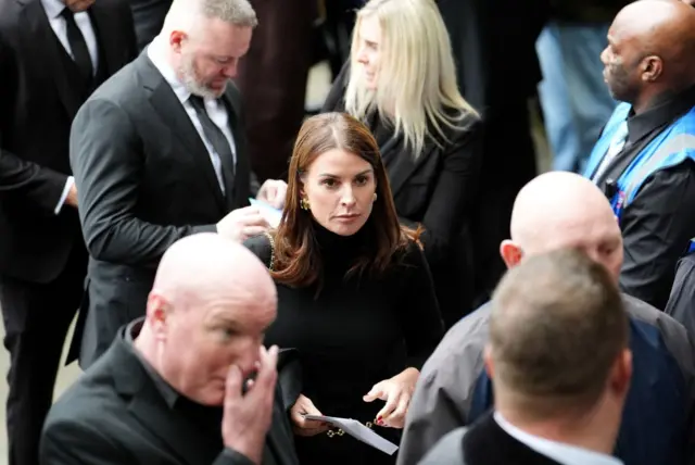 Coleen Rooney arrives ahead of the funeral