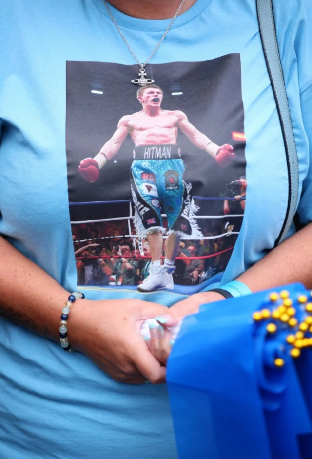 Woman sporting a branded Ricky Hatton tshirt