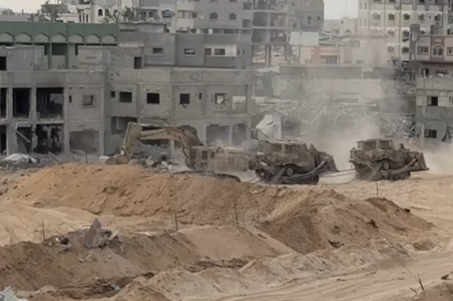 israeli military bulldozers and other equipment were seen on the move in the Gaza Strip on Friday
