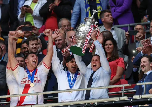 Willie Peters hold the Challenge Cup trophy aloft at Wembley