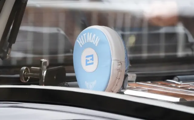 A boxing pad in the hearse carrying the coffin of Ricky Hatton arriving at Manchester Cathedral.