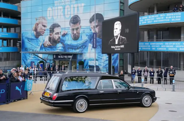 Ricky Hatton's hearse arrives at the Etihad Stadium following the funeral earlier