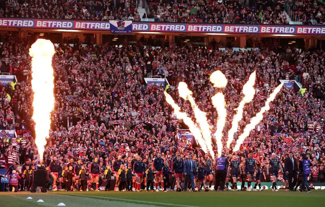 Flamethrowers go off as Hull KR and Wigan enter the pitch