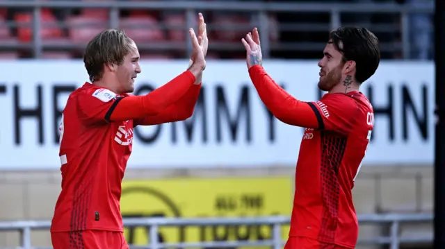 Leyton Orient players celebrate a goal